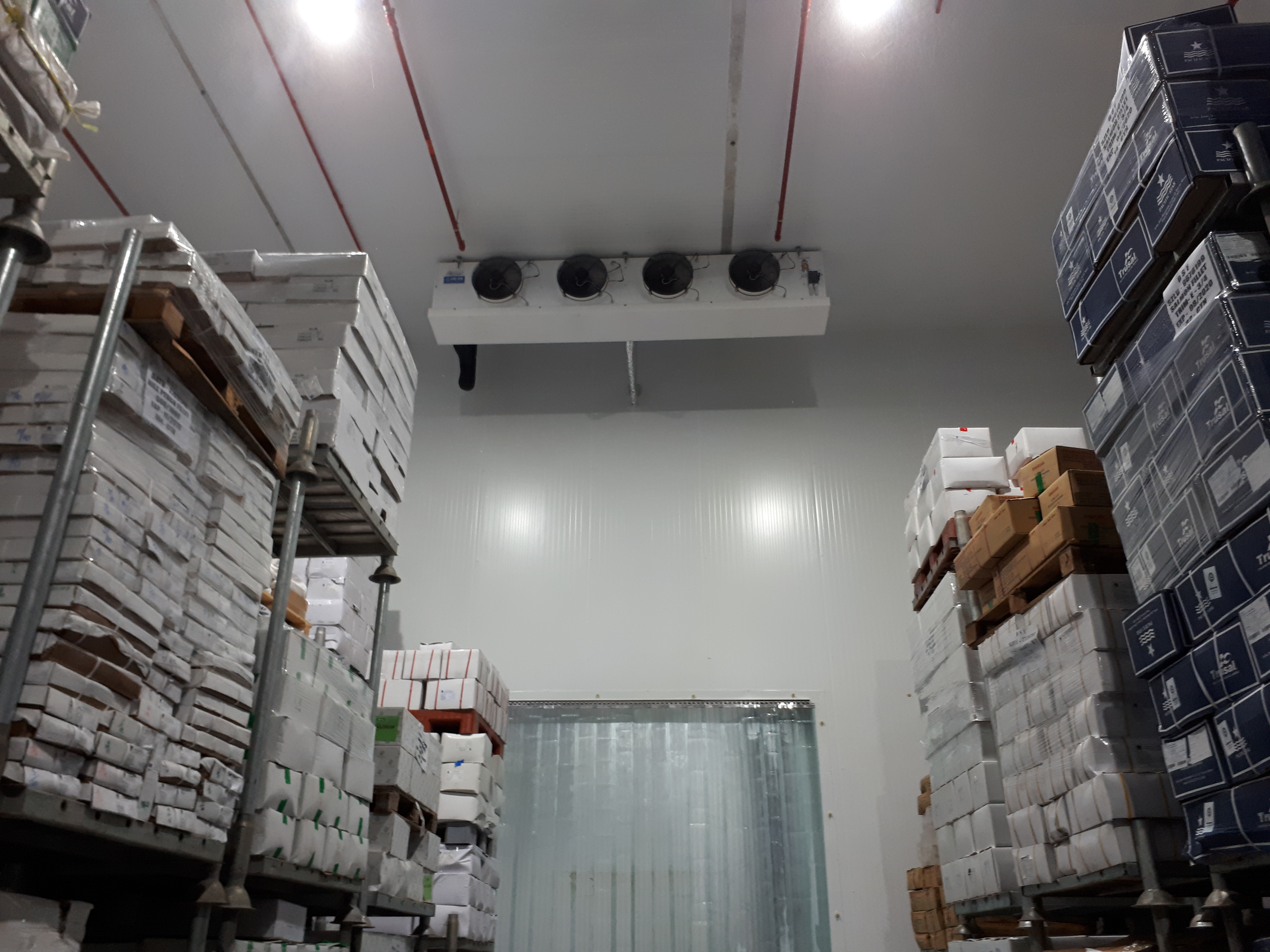 Project name: G2 International LLC, Technopark Dubai<br/>
Refrigeration contractor: Fanar al Khaleej Refrigeration<br/>
Execution: 2017-2018<br/>
Application: Logistic cold store, dry cold store, chiller and freezer cold rooms<br/>
Application with hot gas defrost + electrical in parallel<br/>
Cooling system description:<br/>
- Chilled receiving area: LU-VE Cubic 2# F50HC 1806 E 7 - 40,6kW  (10C_85%_EV-3) R404a<br/>
- 7 cold stores dual application Chiller/Freezer (various sizes): LU-VE Cubic 15# F50HC 1808 E 7 - 21,4kW (-20C_85%_EV-27C) R404a<br/>
- 2 cold stores dual application Chiller/Freezer (various sizes): LU-VE Cubic 4# F50HC 1806 E 7 - 17,4kW (-20C_85%_EV-27C) R404a<br/>
- 1 cold stores dual application Chiller/Freezer (various sizes): LU-VE Cubic 1# F45HC 1320 E 7 - 30,3kW (-20C_85%_EV-27C) R404a<br/>
- Corridor: LU-VE Cubic 2# F50HC 1706 E 6 - 40,6kW  (5_85%_EV-3) R404a<br/>
- Dry storage area (1800sqm): LU-VE Cubic 3# F71HC 4208 N 6 – 65,8kW (22C_65%_EV-27C) R134a<br/>
- Technical Store: LU-VE Cubic 1# F45HC 1112 N 4 – 28,9kW (22C_65%_EV-27C) R134a<br/>
- Plant room: LU-VE Cubic 1# F35HC 261 N 6 – 19,4kW (25C_65%_EV-27C) R134a<br/>
Rack System:<br/>
- 1# Profroid 200HP Rack for LT application R404a<br/>
- 1# Profroid 120HP Rack for MT application R134a
