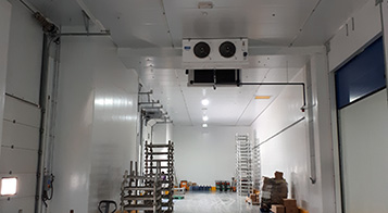 Project name: G2 International LLC, Technopark Dubai<br/>
Refrigeration contractor: Fanar al Khaleej Refrigeration<br/>
Execution: 2017-2018<br/>
Application: Logistic cold store, dry cold store, chiller and freezer cold rooms<br/>
Application with hot gas defrost + electrical in parallel<br/>
Cooling system description:<br/>
- Chilled receiving area: LU-VE Cubic 2# F50HC 1806 E 7 - 40,6kW  (10C_85%_EV-3) R404a<br/>
- 7 cold stores dual application Chiller/Freezer (various sizes): LU-VE Cubic 15# F50HC 1808 E 7 - 21,4kW (-20C_85%_EV-27C) R404a<br/>
- 2 cold stores dual application Chiller/Freezer (various sizes): LU-VE Cubic 4# F50HC 1806 E 7 - 17,4kW (-20C_85%_EV-27C) R404a<br/>
- 1 cold stores dual application Chiller/Freezer (various sizes): LU-VE Cubic 1# F45HC 1320 E 7 - 30,3kW (-20C_85%_EV-27C) R404a<br/>
- Corridor: LU-VE Cubic 2# F50HC 1706 E 6 - 40,6kW  (5_85%_EV-3) R404a<br/>
- Dry storage area (1800sqm): LU-VE Cubic 3# F71HC 4208 N 6 – 65,8kW (22C_65%_EV-27C) R134a<br/>
- Technical Store: LU-VE Cubic 1# F45HC 1112 N 4 – 28,9kW (22C_65%_EV-27C) R134a<br/>
- Plant room: LU-VE Cubic 1# F35HC 261 N 6 – 19,4kW (25C_65%_EV-27C) R134a<br/>
Rack System:<br/>
- 1# Profroid 200HP Rack for LT application R404a<br/>
- 1# Profroid 120HP Rack for MT application R134a
