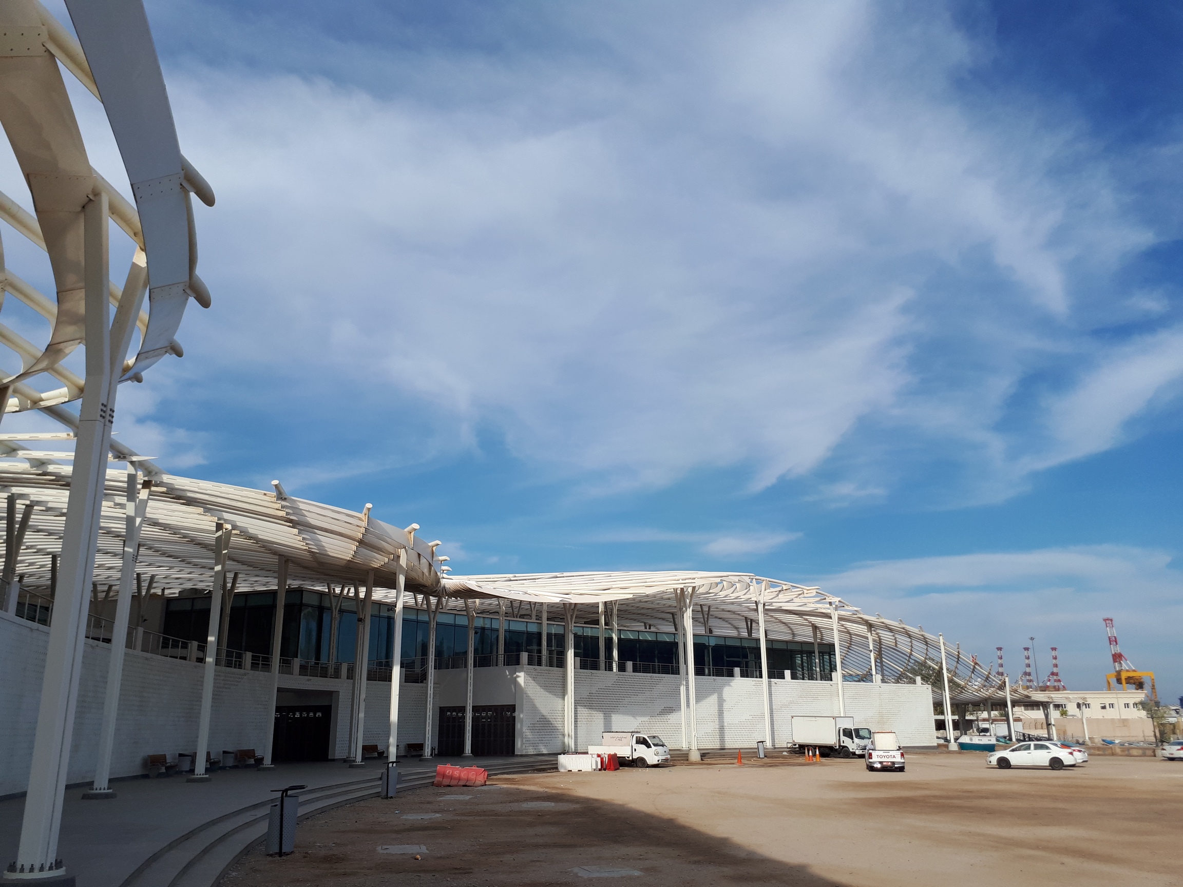 The Fish Market is located at the heart of Mutrah, and is essential for both the continuation of historical trading traditions and the needs of Oman's growing tourism industry. <br>
The radial shape of Mutrah's characteristic bay shows a clear relationship between the city, the mountains and the waterfront. The bay is emphasized in the form of the new fish market, which references both the former waterfront and the continuation of the corniche. This is further articulated in the curved wall that defines the northern spine of the new fish market in Mutrah.<br>
The new market enhances the public setting by forming a dynamic shaded canopy, organizing the spaces beneath, both visually and environmentally. The canopy’s form is derived from the sinuous flow of Arabic calligraphy - playful movement of light and shadow built from aluminum fins, and providing shade, natural ventilation, and an ephemeral appearance.<br>
The new fish market will provide the city with a strong focal point, layering local activities, the fishing industry and tourism in Mutrah, sympathetically uniting the old and new. The design introduces a new landmark on the waterfront along the lively corniche in Mutrah.<br>
<br>
Installation LU-VE:<br>
LU-VE Condenser: SHVDN 483 SPEC COIL CUSN/CUSN - HT FANS (2 Pieces)<br>
LU-VE Condenser: SHVDN 322 SPEC COIL CUSN/CUSN - HT FANS (2 Pieces)<br>
LU-VE Condenser: XDHV1F 1134 SPEC COIL CUSN/CUSN - HT FANS (1 Piece) 